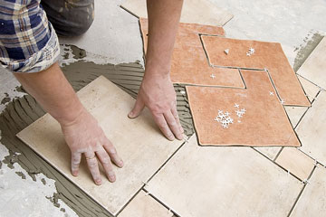 a flooring contractor installing floor tile