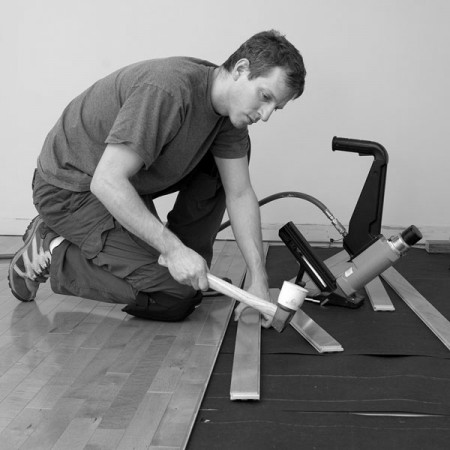 a hardwood flooring installer